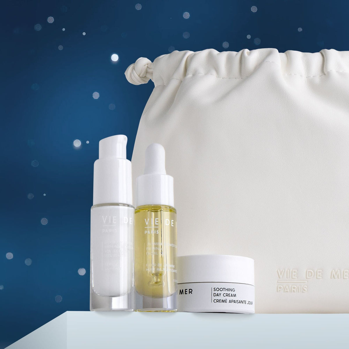 Cosmetic bag with skincare products on a blue background