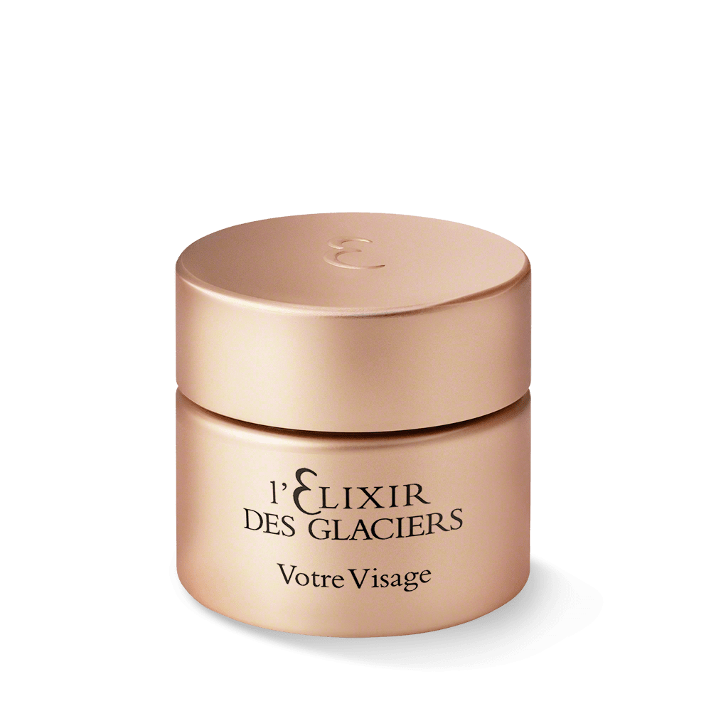Cosmetic jar labeled 'l'Elélixir Des Glaciers Votre Visage' on a white background