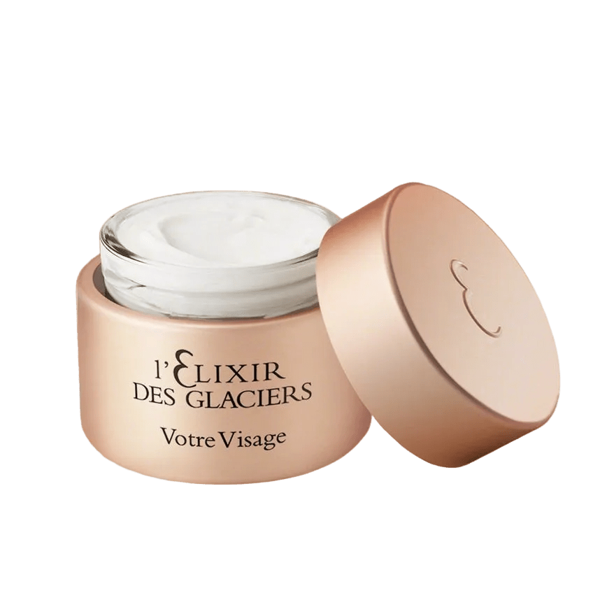 Cosmetic jar labeled 'l'Elélixir Des Glaciers Votre Visage' on a white background