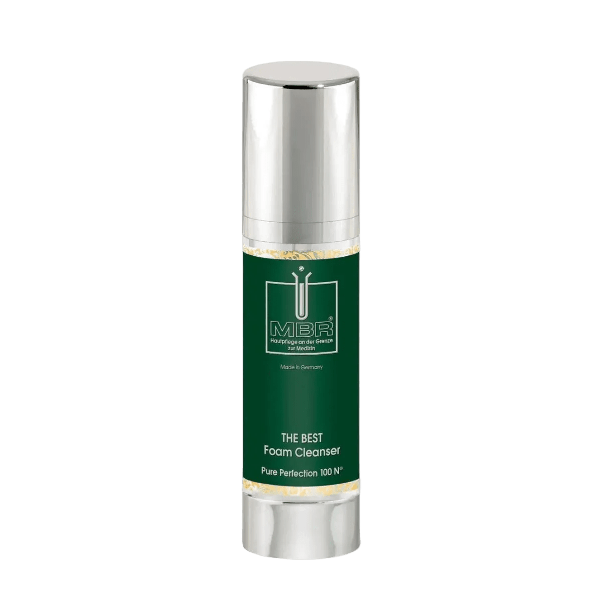 A bottle of MBR The Best Foam Cleanser on a light gray background. The bottle has a metallic silver cap and base with a dark green label featuring gold accents and the MBR logo.